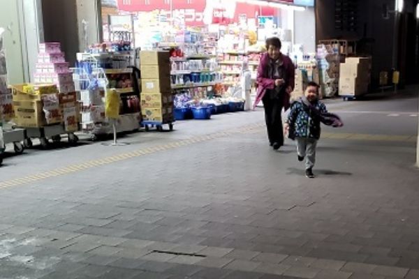 An elderly mother runs.